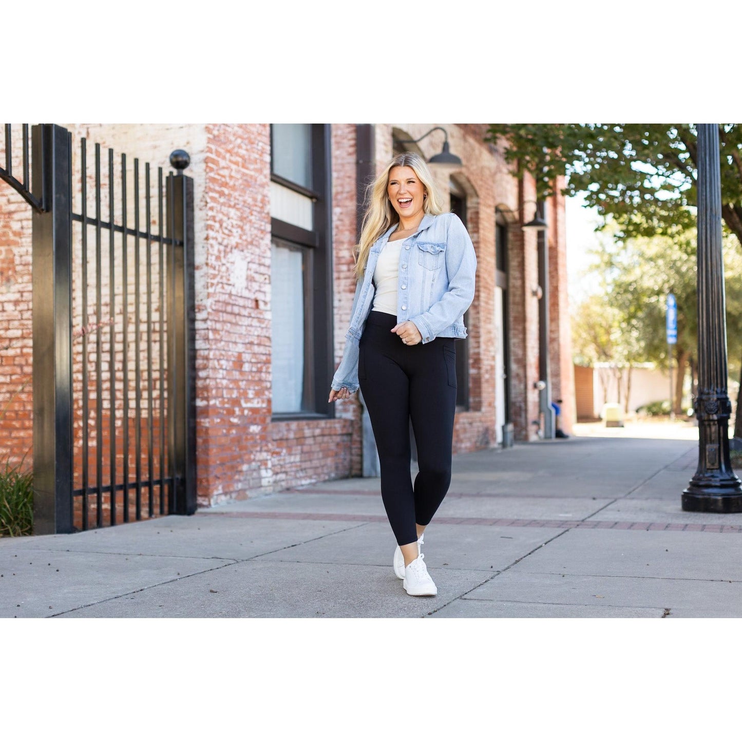 High-waisted black ankle length leggings with pockets by Julia Rose, Julia Rose women’s black 7/8 leggings lifestyle image