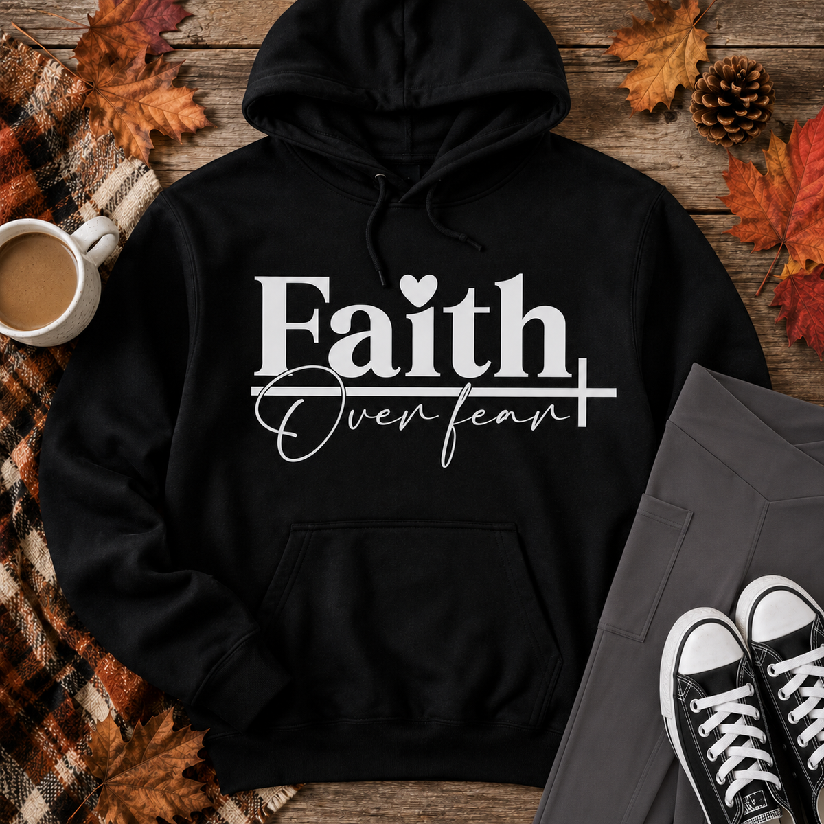 Julia Rose Faith Over Fear apparel featuring a white heart and cross design, available as a crewneck, V-neck, long-sleeve T-shirt and hoodie.