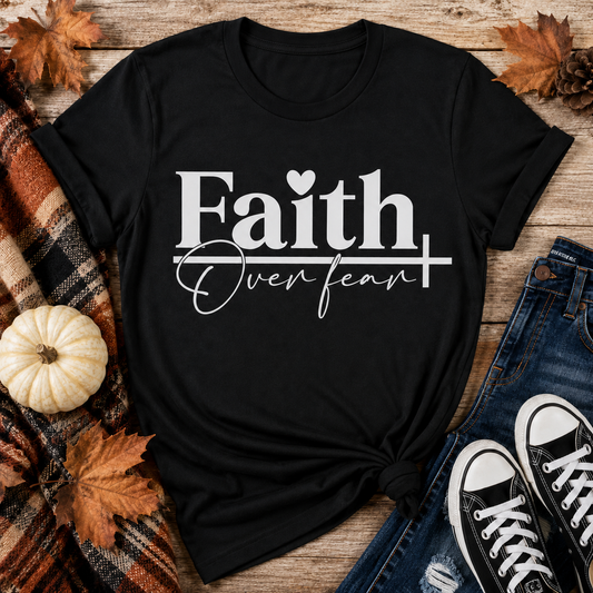 Julia Rose Faith Over Fear apparel featuring a white heart and cross design, available as a crewneck, V-neck, long-sleeve T-shirt and hoodie.