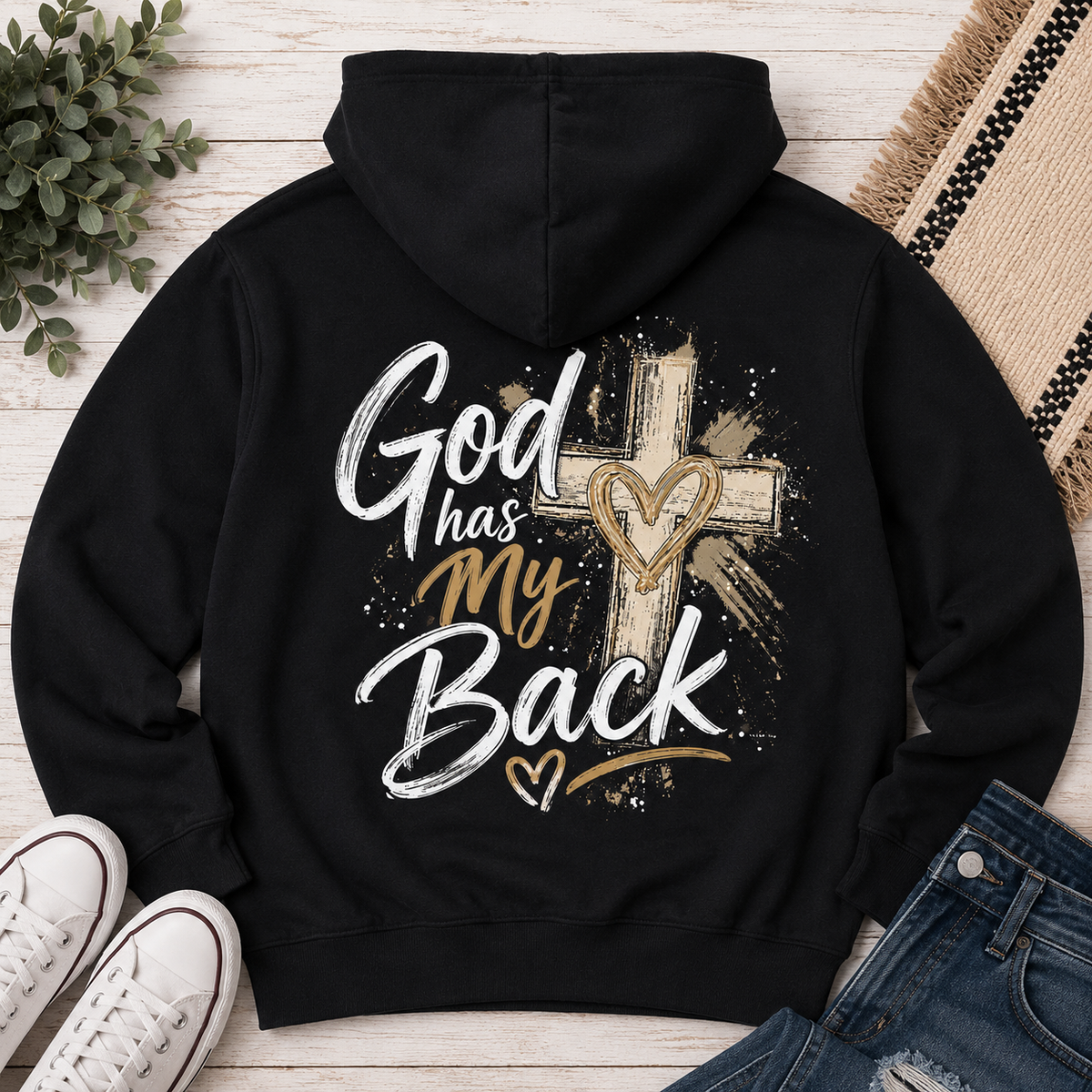 Back: Black God Has My Back hoodie with a large white and brown cross graphic and distressed faith-inspired design.
